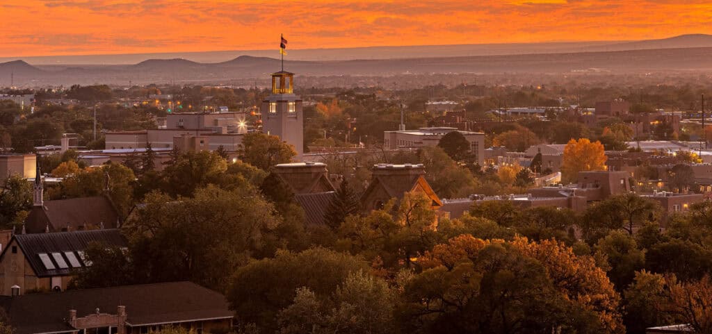 View of a town with the sun setting in the horizon